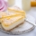 Cheesecake con pesche e cardamomo